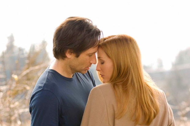 An intimate moment between the X-Files' Mulder and Scully
